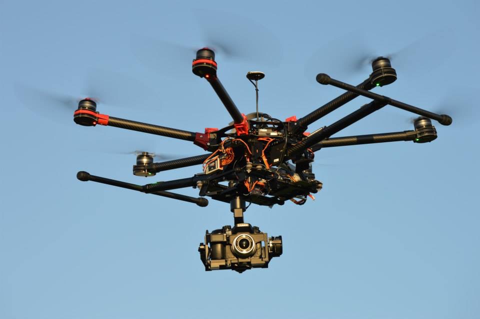 Professional heavy-lift drone with mounted camera used for aerial photography, mapping, and inspections.