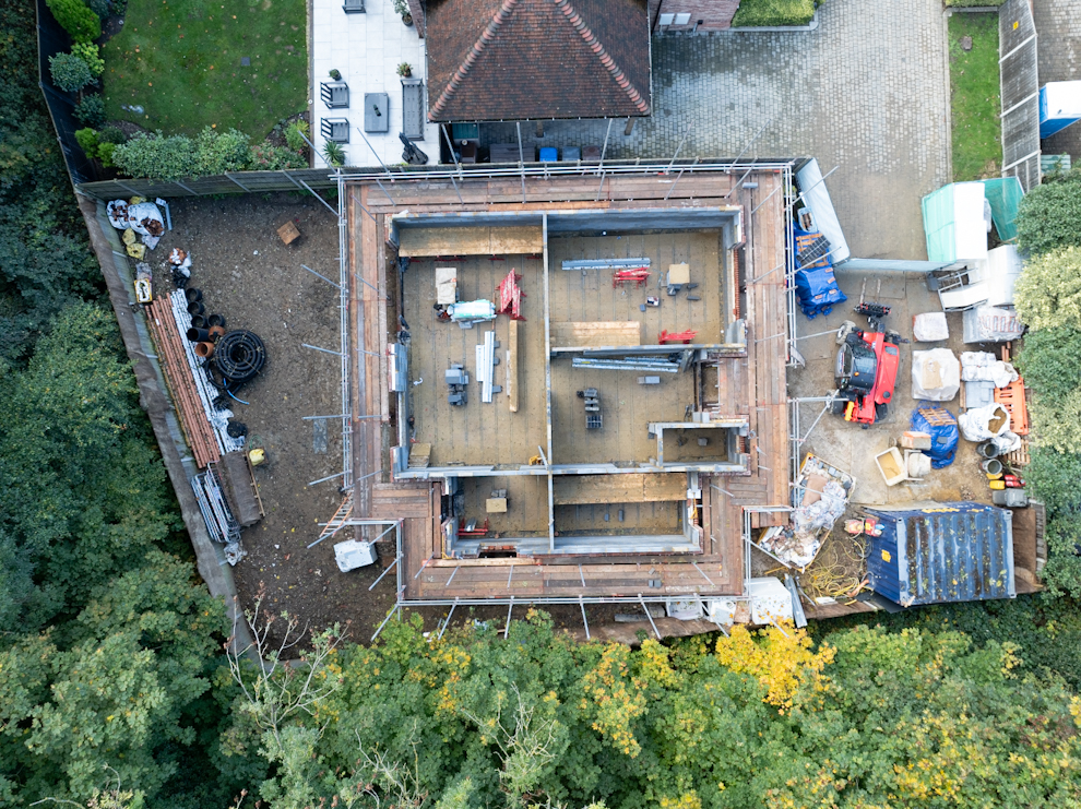 Drone photo showing a house under construction without a roof in Thames Valley, UK